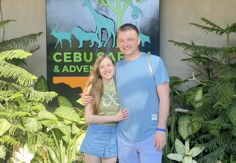Visitors exploring the historic Magellan's Cross landmark